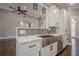 Modern kitchen with white cabinets, stainless steel appliances, and quartz countertops at 6204 Woodlore Nw Dr, Acworth, GA 30101