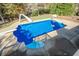 Inviting in-ground pool with a slide and basketball hoop at 6204 Woodlore Nw Dr, Acworth, GA 30101