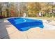 Inviting backyard swimming pool with slide and basketball hoop at 6204 Woodlore Nw Dr, Acworth, GA 30101