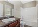 Clean bathroom with tub/shower combo, vanity, and toilet at 1410 Metropolitan Sw Pkwy, Atlanta, GA 30310