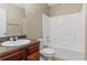 Neat bathroom with shower/tub, sink, and toilet at 1410 Metropolitan Sw Pkwy, Atlanta, GA 30310