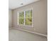 Simple bedroom with large window and neutral wall color at 1410 Metropolitan Sw Pkwy, Atlanta, GA 30310