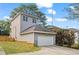 Detached garage with a driveway and a neatly landscaped yard at 1410 Metropolitan Sw Pkwy, Atlanta, GA 30310