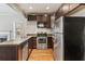 Modern kitchen with stainless steel appliances and dark cabinets at 1410 Metropolitan Sw Pkwy, Atlanta, GA 30310