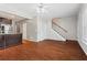 Spacious living room with hardwood floors and staircase at 1410 Metropolitan Sw Pkwy, Atlanta, GA 30310