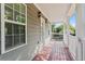 Inviting porch with wooden deck and white railings at 1410 Metropolitan Sw Pkwy, Atlanta, GA 30310