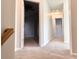 Upstairs hallway with carpet and access to bedrooms at 4010 Bradstone Nw Trce, Lilburn, GA 30047