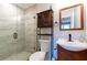 Updated bathroom with walk-in shower, toilet and vanity at 8 Holly Downs Nw Ct, Atlanta, GA 30318