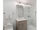 Modern bathroom with marble shower, vanity, and updated fixtures at 3220 Farmington Se Dr, Atlanta, GA 30339