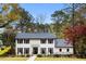 Stunning two-story home with black shutters and manicured lawn at 3220 Farmington Se Dr, Atlanta, GA 30339