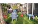 Backyard patio with artificial turf, fire pit, and seating at 4846 Twin Lakes Trl, Atlanta, GA 30360