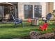Backyard patio with artificial turf, fire pit, and seating at 4846 Twin Lakes Trl, Atlanta, GA 30360