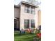 Backyard patio with artificial turf, fire pit, and seating at 4846 Twin Lakes Trl, Atlanta, GA 30360
