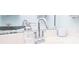 Clean bathroom featuring a modern faucet and sleek countertop at 4846 Twin Lakes Trl, Atlanta, GA 30360