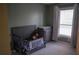 bedroom with crib, dresser, and calming green walls at 4846 Twin Lakes Trl, Atlanta, GA 30360