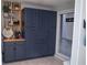 Modern kitchen with dark blue cabinets and wood counter at 4846 Twin Lakes Trl, Atlanta, GA 30360