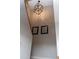 Stylish light fixture and wall art on the stairway at 4846 Twin Lakes Trl, Atlanta, GA 30360