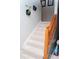 Stairs with carpeted steps and wooden railing leading to the upper level at 4846 Twin Lakes Trl, Atlanta, GA 30360