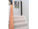 Upper level stairs with carpeted steps and wooden railing at 4846 Twin Lakes Trl, Atlanta, GA 30360