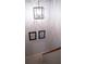 Stairwell with a modern light fixture and framed artwork at 4846 Twin Lakes Trl, Atlanta, GA 30360