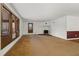 Spacious living room with wood-burning stove and carpet at 5262 Keithwood Dr, Cumming, GA 30040