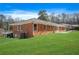 Brick home showcasing a large backyard at 719 Lynn Valley Sw Rd, Atlanta, GA 30311