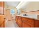 Updated bathroom with double vanity and pink tile at 719 Lynn Valley Sw Rd, Atlanta, GA 30311