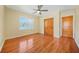 Hardwood floor bedroom with double doors and a window at 719 Lynn Valley Sw Rd, Atlanta, GA 30311