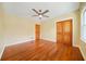 Bright bedroom featuring hardwood floors and ceiling fan at 719 Lynn Valley Sw Rd, Atlanta, GA 30311
