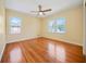 Spacious bedroom with hardwood floors and two windows at 719 Lynn Valley Sw Rd, Atlanta, GA 30311