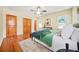 Main bedroom with hardwood floors and double doors to closet at 719 Lynn Valley Sw Rd, Atlanta, GA 30311