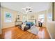 Spacious bedroom with hardwood floors, ceiling fan, and natural light at 719 Lynn Valley Sw Rd, Atlanta, GA 30311