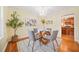 Bright dining room with hardwood floors and kitchen view at 719 Lynn Valley Sw Rd, Atlanta, GA 30311