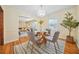 Formal dining room featuring hardwood floors and view into living room at 719 Lynn Valley Sw Rd, Atlanta, GA 30311