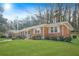 Side view of brick ranch home showcasing large yard at 719 Lynn Valley Sw Rd, Atlanta, GA 30311