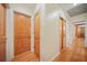 Hardwood floor hallway with neutral walls and wood doors at 719 Lynn Valley Sw Rd, Atlanta, GA 30311