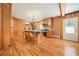 Bright kitchen featuring an island, wood cabinets, and hardwood floors at 719 Lynn Valley Sw Rd, Atlanta, GA 30311