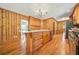 Modern kitchen with center island, updated cabinetry, and hardwood floors at 719 Lynn Valley Sw Rd, Atlanta, GA 30311
