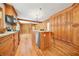 Renovated kitchen with island, stainless steel appliances, and wood flooring at 719 Lynn Valley Sw Rd, Atlanta, GA 30311