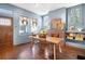 Bright dining area with hardwood floors, fireplace, and built-in shelves at 836 Dill Sw Ave, Atlanta, GA 30310