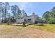 Backyard view of house with deck and open space at 3365 Turtle Lake Se Dr, Marietta, GA 30067