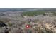 Aerial view showing home's location in a quiet wooded neighborhood at 66 Trevor Way, Temple, GA 30179