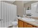 Clean bathroom with shower/tub combo and wood vanity at 66 Trevor Way, Temple, GA 30179