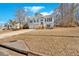Two-story house with gray siding and a view of the front yard and neighborhood at 66 Trevor Way, Temple, GA 30179
