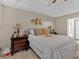 Spacious main bedroom with king-size bed and ensuite bathroom at 66 Trevor Way, Temple, GA 30179