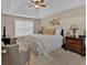 Relaxing main bedroom with a king-size bed and tray ceiling at 66 Trevor Way, Temple, GA 30179