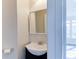 Simple bathroom with a white sink and mirror at 962 Pierce Ivy Ct, Lawrenceville, GA 30043