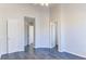Bright bedroom with tile floors and access to hallway at 962 Pierce Ivy Ct, Lawrenceville, GA 30043