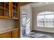 Bright breakfast area with built-in cabinetry and tile floor at 962 Pierce Ivy Ct, Lawrenceville, GA 30043