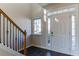 Bright entryway with tile floors and a staircase at 962 Pierce Ivy Ct, Lawrenceville, GA 30043